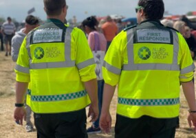Two AMG Responders walking at a festival